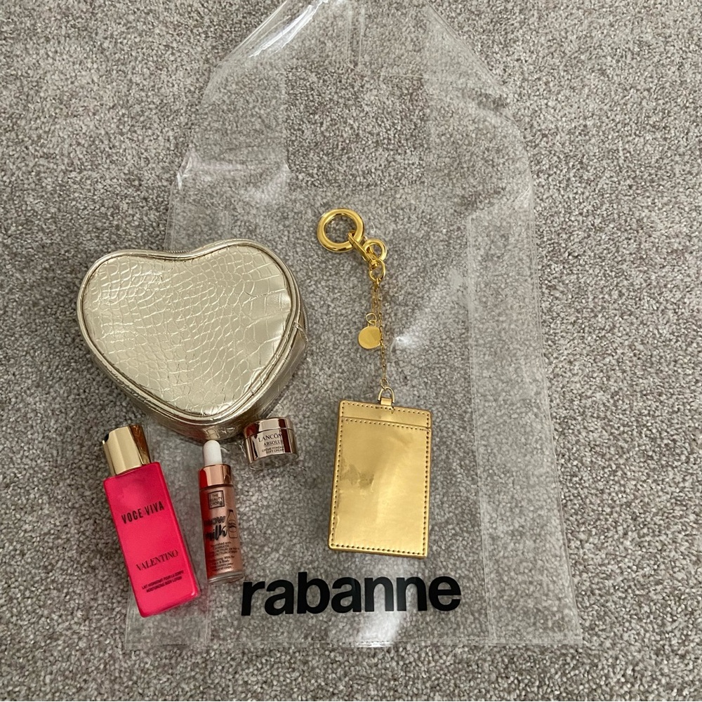 5 items - Rabanne Transparent Tote with Gold Heart Pouch, lotion and more! ⭐️